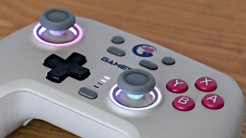Close-up of a controller, the Gamesir Nova, with RGB rings around the joysticks.