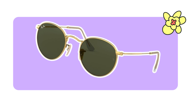 A pair of gold-rimmed round metal Ray-Ban sunglasses.