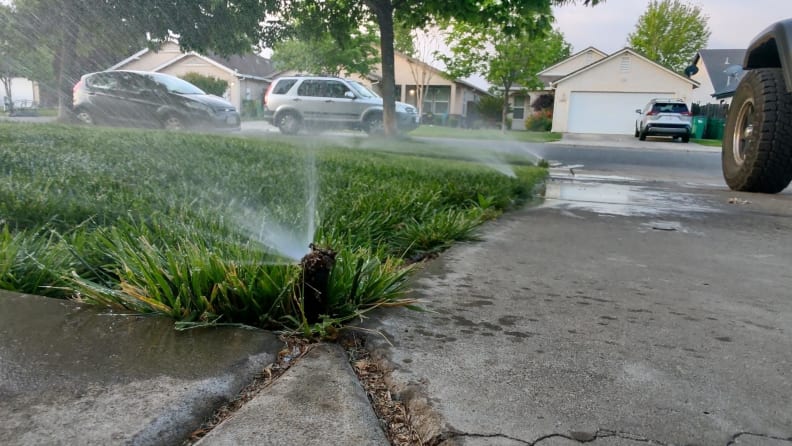 Close-up shot of the Wyze sprinkler in action watering the front yard.