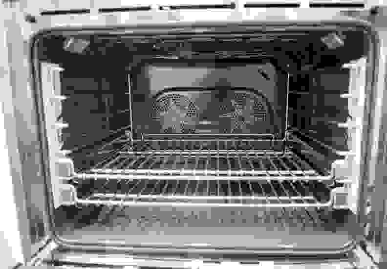 Oven cavity with convection fans and oven racks