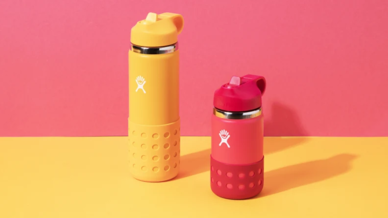 Two yellow and red  Hydro Flask Kids’ Wide Mouth water bottle, that come in a variety of colors.
