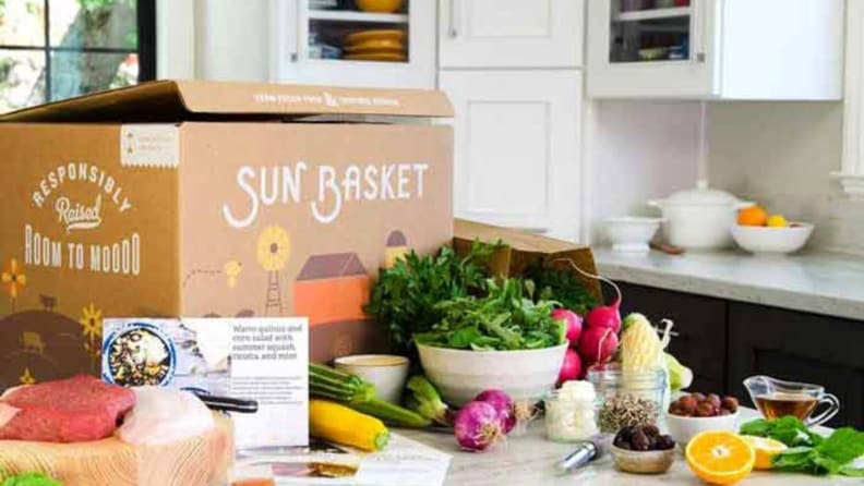Sunbasket box with ingredients and menu cards in front