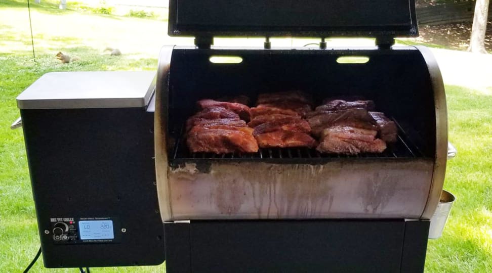 A Rec Tec grill with cooked meat inside