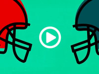 An image of two football helmets facing toward a digital "play" icon.
