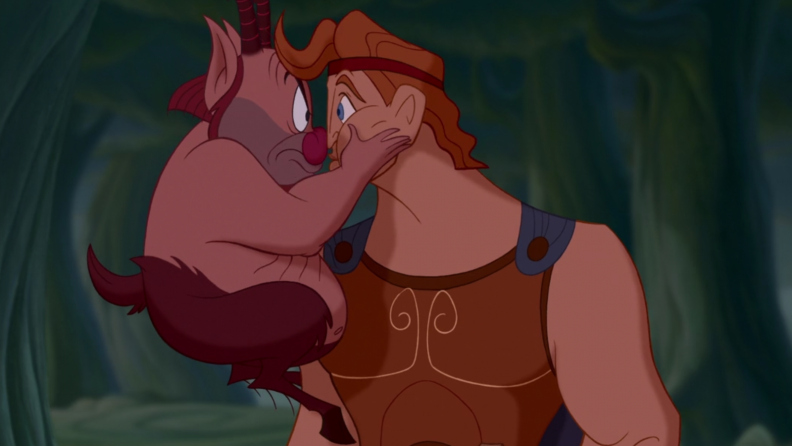 A still from 'Hercules' featuring Phil grabbing Hercules by the face.