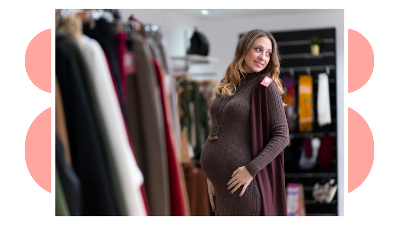 Image of a mother looking at herself in an out-of-frame mirror as she tries on maternity clothes.