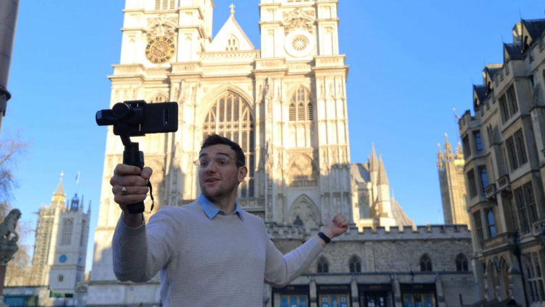 Man taking a selfie in front of a castle