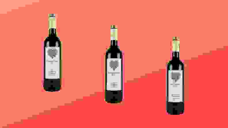 Three bottles of Longevity Cabernet Sauvignon wine are arranged across a red gradient background.