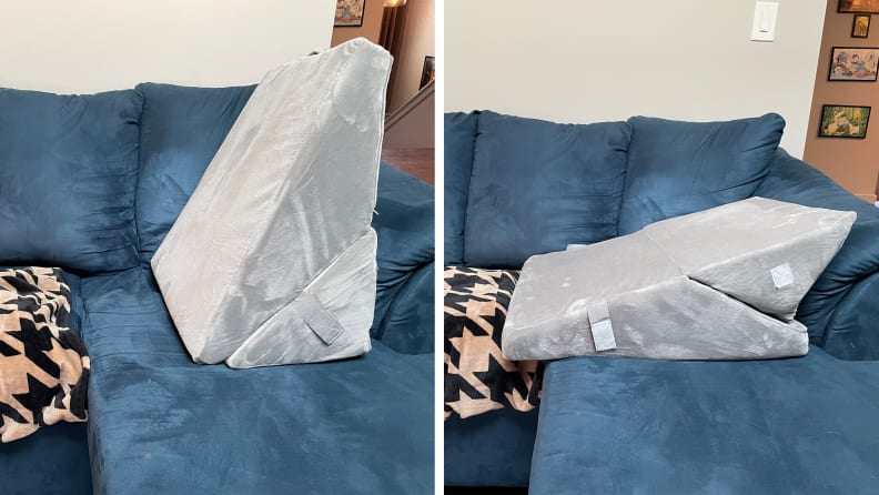 A gray All Sett Health Folding Wedge Pillow upright and horizontal on top of blue suede couch.