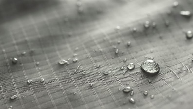 Close up of a waterproof bag with drops of water.