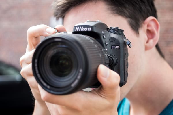 Photo of shooter framing a shot with the Nikon D7200.