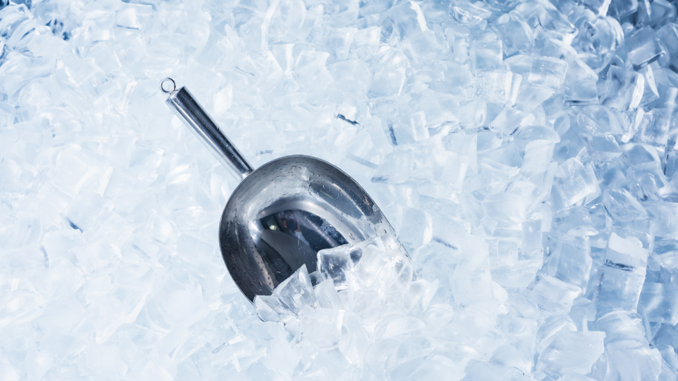 Close up photo of ice with scooper.
