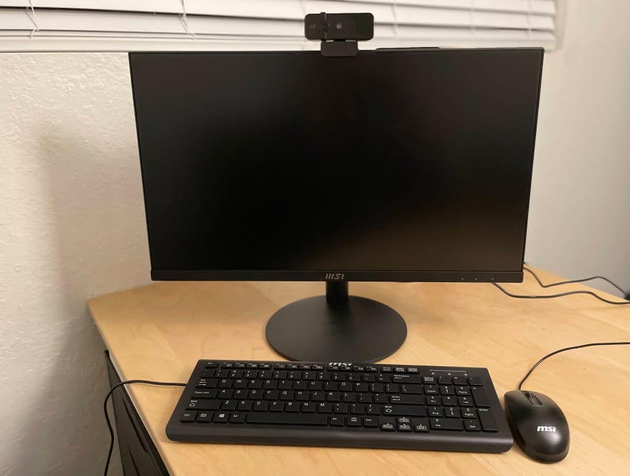 A computer monitor, keyboard, and mouse
