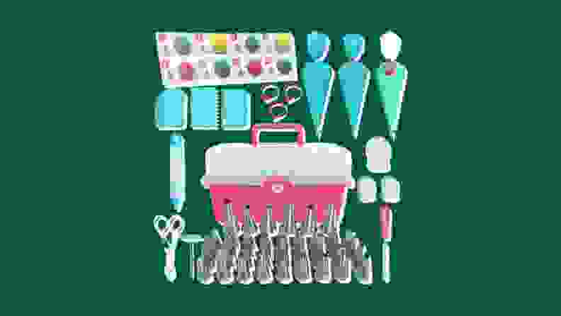 Items in a 68-piece cookie decorating set on a green background