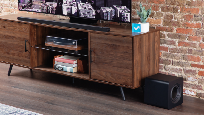The soundbar set up in a TV table.