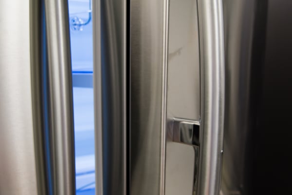Door-in-door access is subtly hidden at the back of the Samsung RF28HDEDBSR's regular door handle.