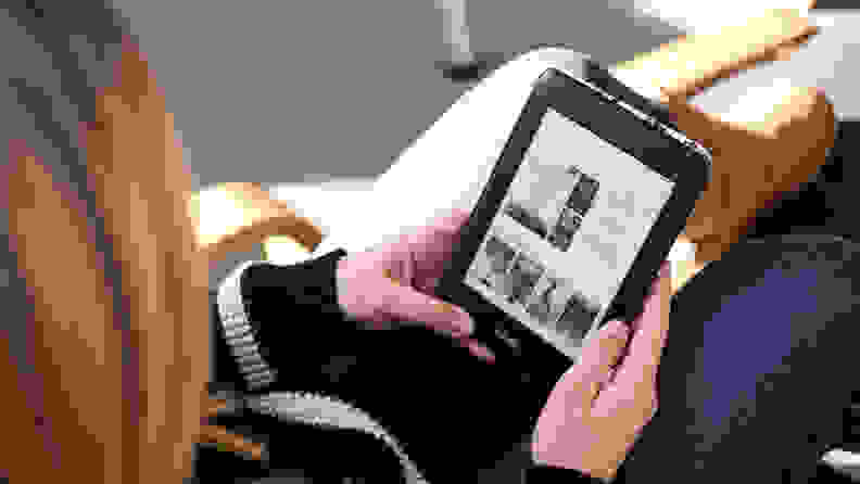 woman reading a Kindle