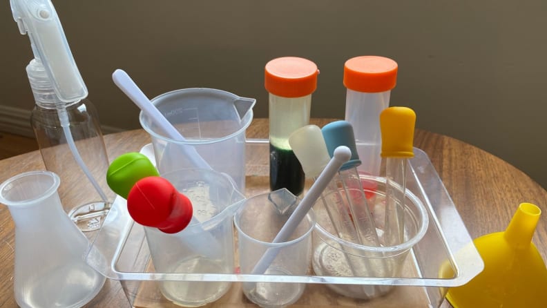 A group of kids' test tubes, beakers, and droppers