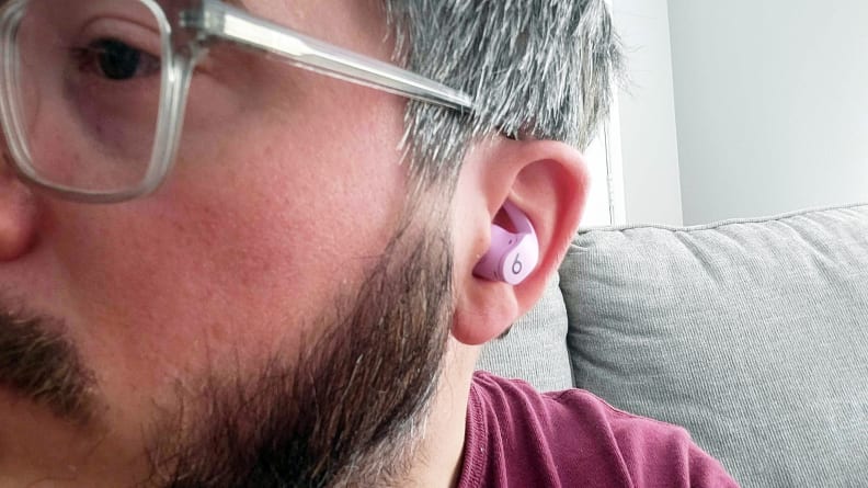 Man wearing a Beat Fit Pro earbud, close up on ear