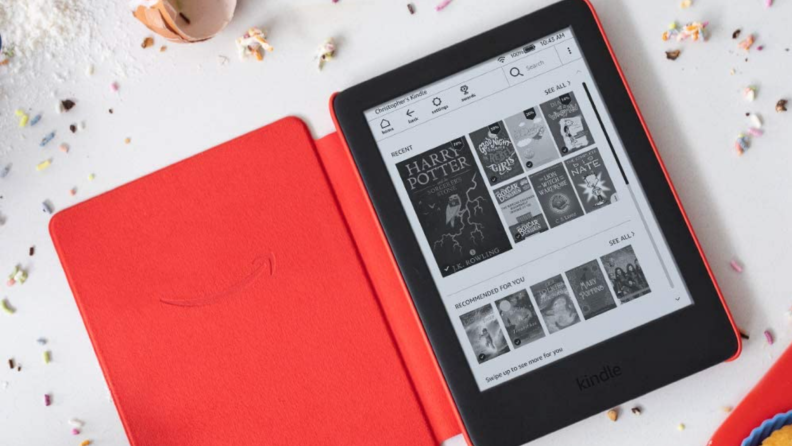 Kindle tablet in red case surrounded by sprinkles.