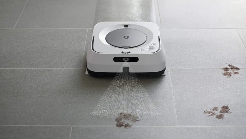 A robot mop slides down a tile floor.
