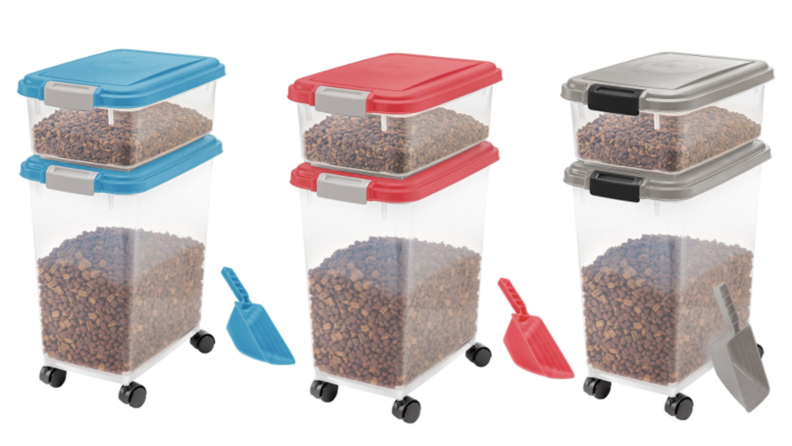 Three food storage contains in blue, pink, and gray