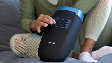 Close-up photo of a model enjoying the LifePro Hand Massager.