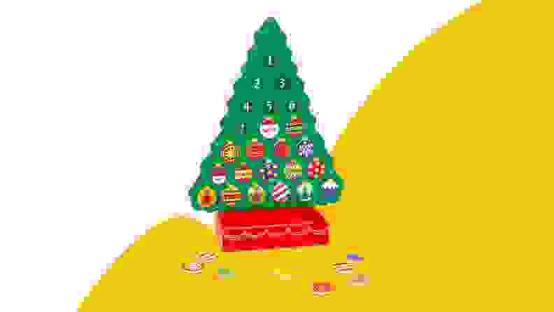 Christmas tree toy on yellow background