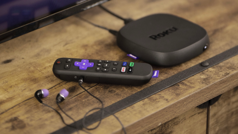 A Roku Ultra on an entertainment center.