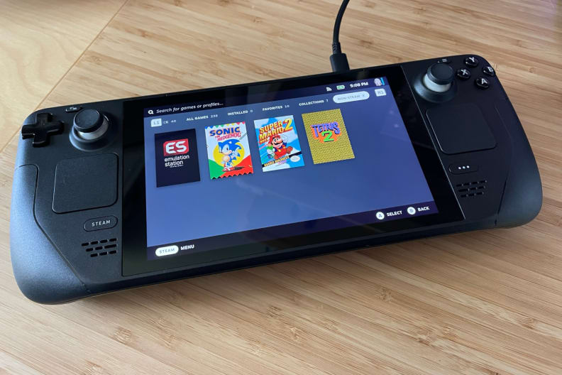 Thumbnail images showing on the screen of black handheld gaming console