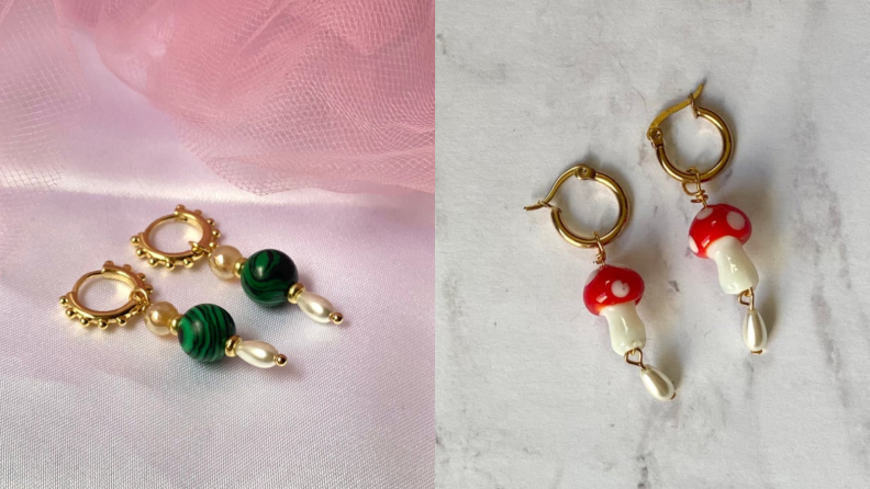 Two pairs of charm earrings, one with a green stone and gold hoops and the other with mushroom charms and gold hoops.