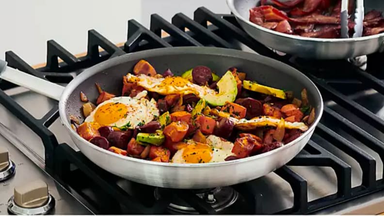 Picture of a stainless steel frying pan on a stove.