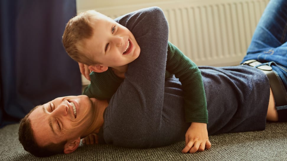 Dad and boy roughhousing