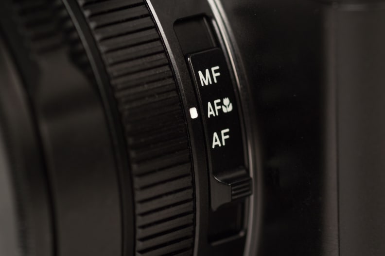 A photograph of the Panasonic Lumix LX100's focus switch.