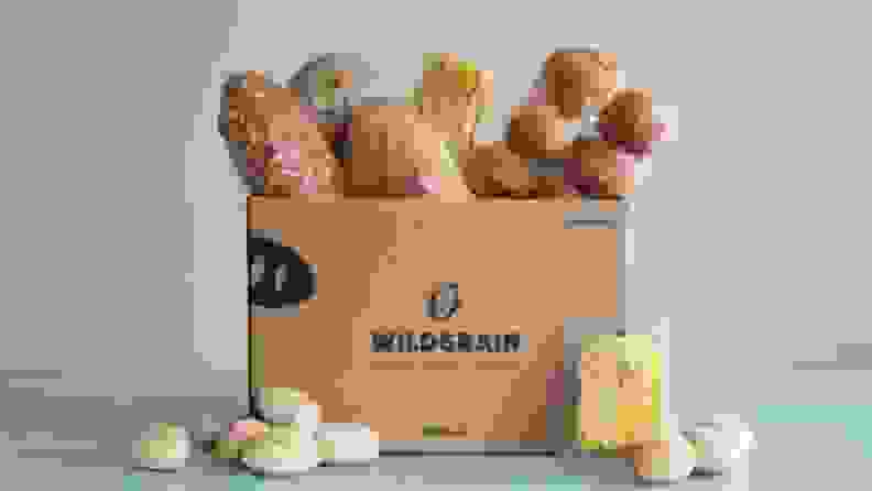A Wildgrain box overflowing with bread, pasta, and pastries.