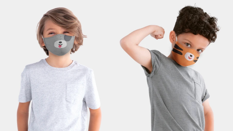 Two children wearing face masks with animal faces on them.