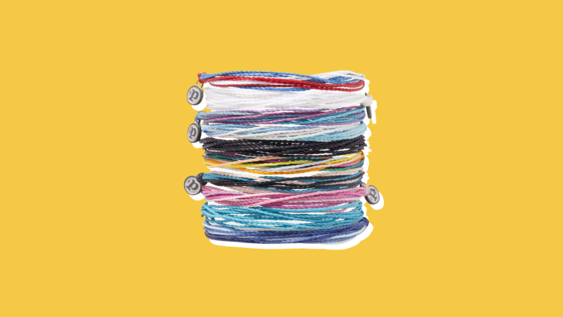 A stack of colorful string bracelets