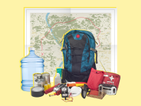 Emergency preparedness items like a backpack, a first aid kit, a radio with antenna, a jug of fresh water, masks, tins cans of food, a geographic map and a flashlight.