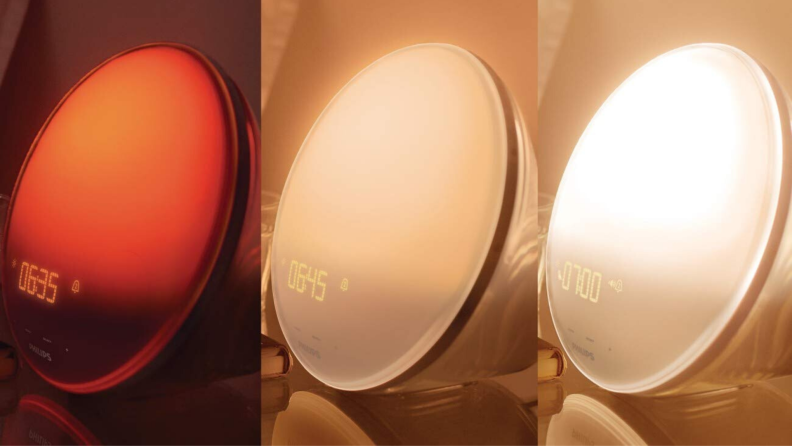 Three color stages of the Philips Wake-Up Light alarm clock that simulates the sunrise