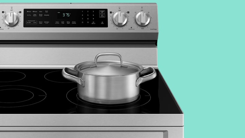 A stainless steel pot sits on a stovetop.