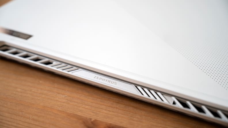 A side view of the Zephyrus G14 showing the top lid's hanging hinge