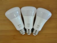 Three Philips Hue bulbs on table