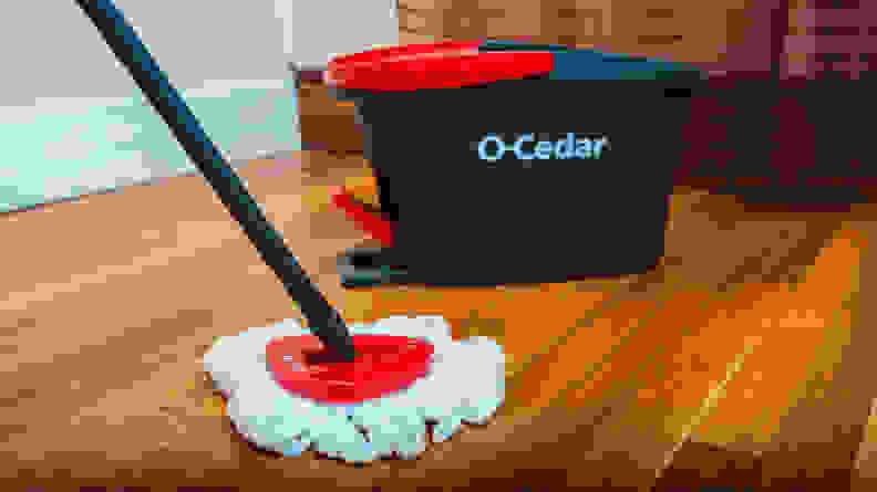 The O-Cedar mop and bucket on a hardwood floor