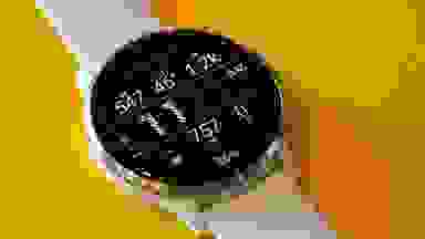 Garmin Venu 3 smartwatch with time displayed on watch face screen.