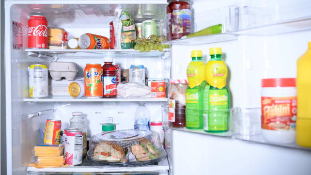 A messy fridge before organizing