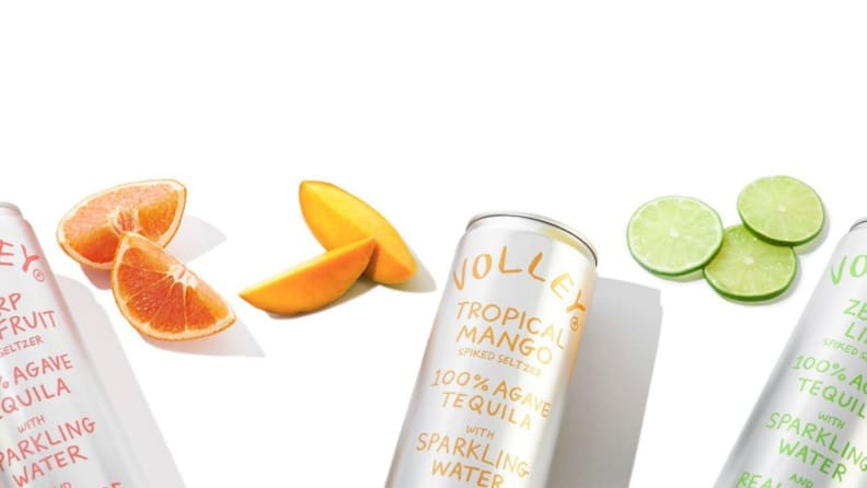 Assorted hard seltzer cans against a white background.