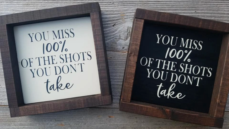 Two sports-themed wedding signs.