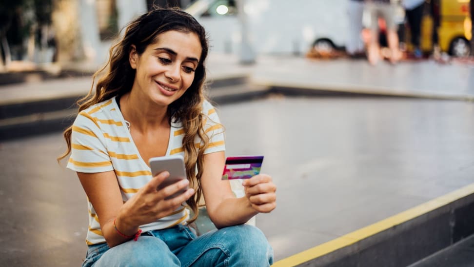 A woman paying her credit card balance