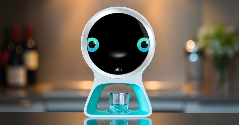 Pillo has two adorable blue eyes and dispenses your pills into a little glass.