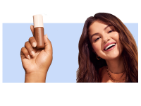 Selena Gomez holding the Rare Beauty Positive Light Tinted Moisturizer SPF 20.